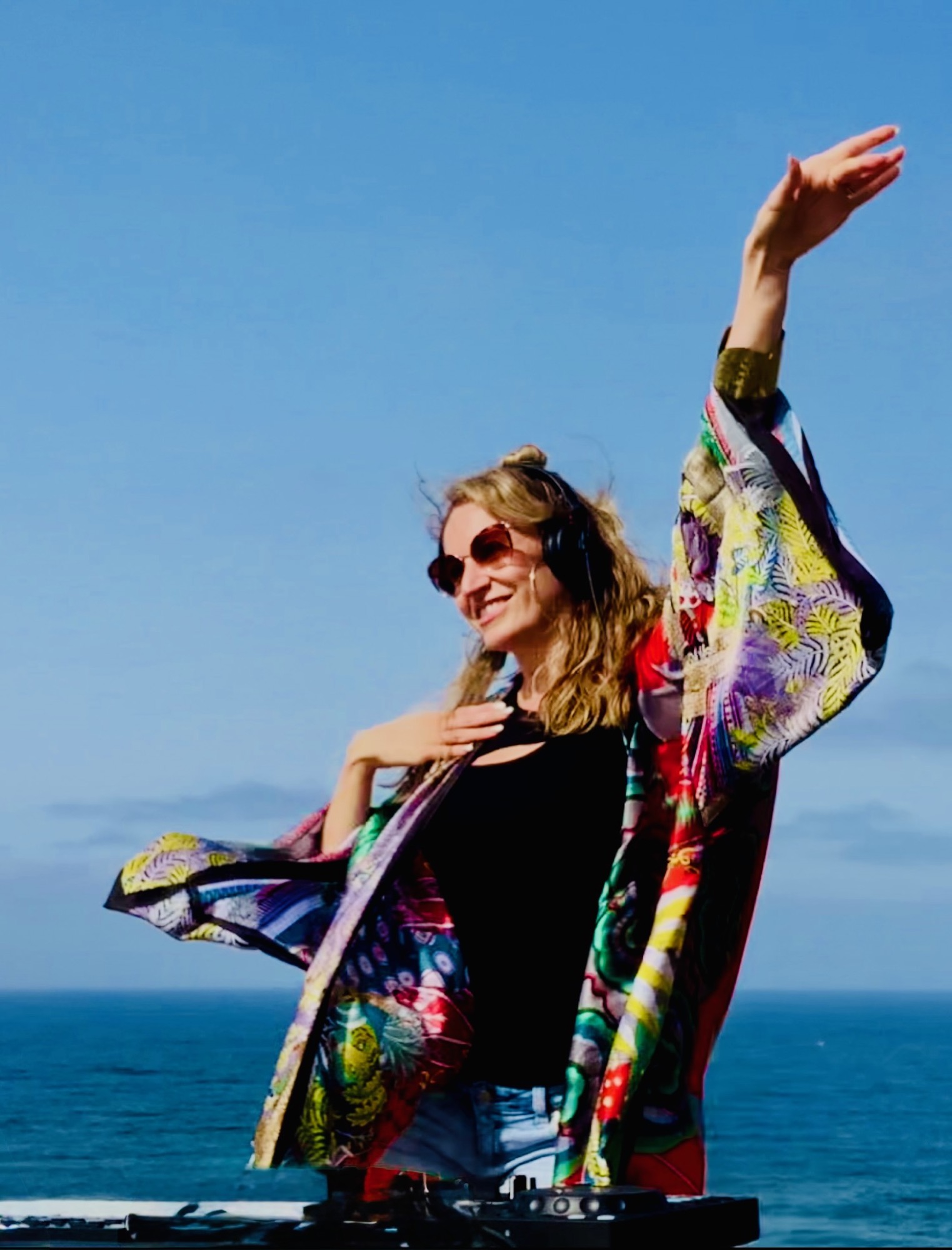 Lady E performing beside the ocean